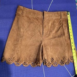 Suede shorts with cutout edges